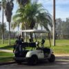 Golf cart at the tee box of a golf course.